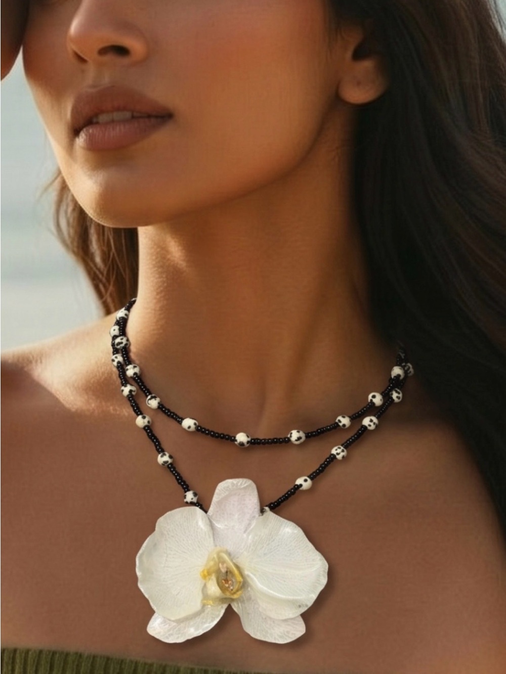Elegant Black Bead Necklace with White Orchid Pendant